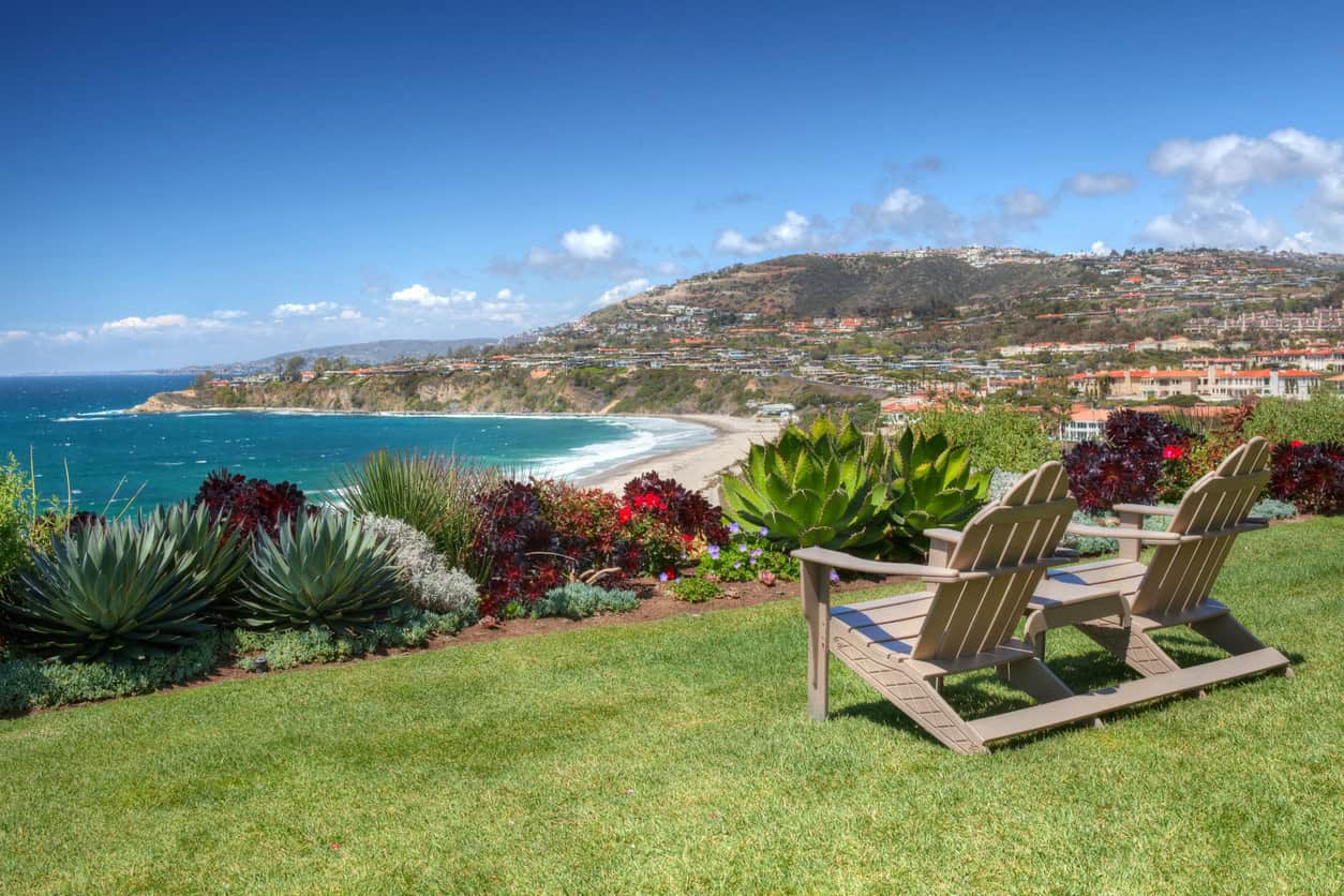 Chairs on cliff overlooking ocean