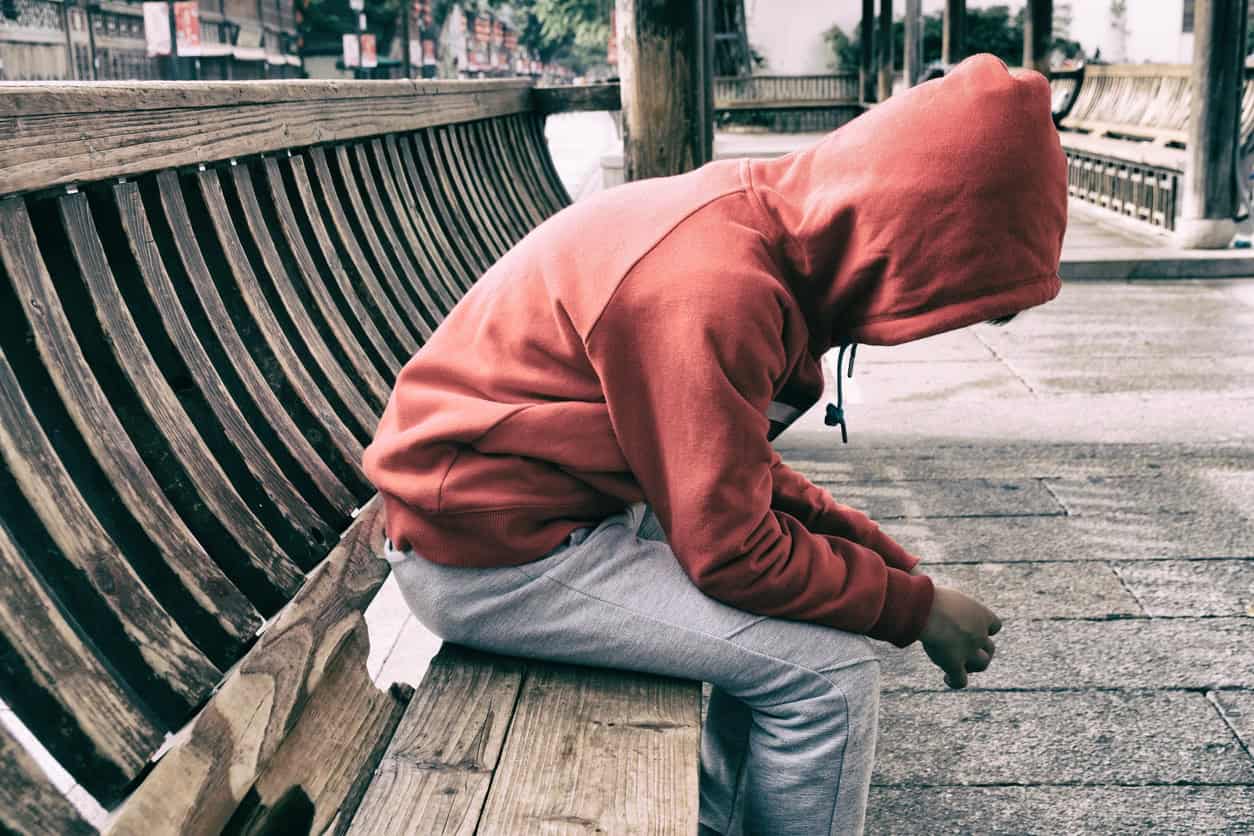 man sitting with head down
